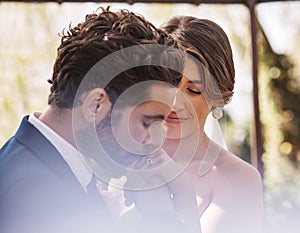 Wedding, happy couple and kiss on hand, celebration and people together in commitment. Bride, man and woman at ceremony