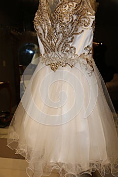Wedding industry- Curly edge tulle on a designer gold and ivory short wedding gown