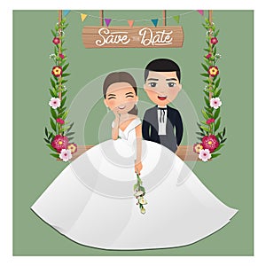 Wedding invitation card the bride and groom cute couple cartoon character sitting on swing decorated with flowers