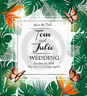 Wedding invitation desing with exotic leaves and coloful flowers photo