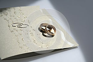 Wedding invitation and rings