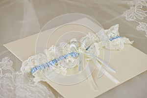 Wedding invitation with a wedding garter