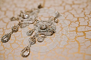 Wedding jewelry, white earrings and bracelet bride, wedding ceremony, the bride`s morning, preparing for the wedding