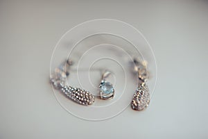Wedding jewelry, white earrings and bracelet bride, wedding ceremony, the bride`s morning, preparing for the wedding