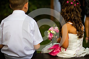 Wedding kids with rose bouquet