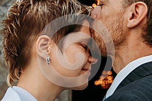 Wedding kiss on forehead
