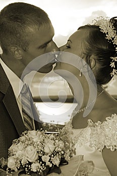 Wedding kiss in sepia colorous