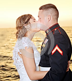 Wedding kiss at sunset