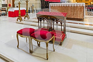 Wedding kneeler and chairs in Catholic church