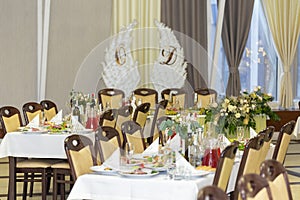 Wedding locations in the restaurant. Tables decorated for a party or wedding reception.