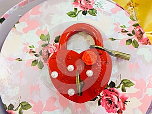The red lock is on the flower box (gift) photo