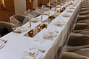 wedding luxury table setting crystal wine glass and gold forks and knives. Catering banquet. table decor for celebration