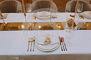 wedding luxury table setting crystal wine glass and gold forks and knives. Catering banquet. table decor for celebration