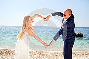 Wedding married couple of hands make a real heart