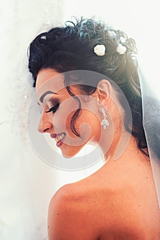 Wedding morning preparation. Happy bride smile on wedding day. Sensual woman with professional makeup. Woman with bridal
