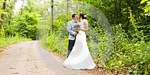 Wedding pair hugging and kissing