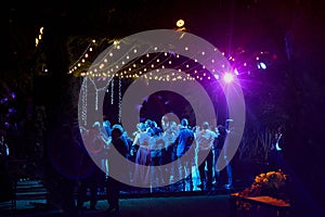 Wedding party dancing at night, outdoor weddings