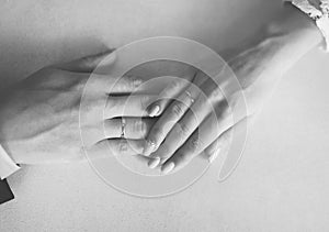 Wedding photo, hand of the bride and groom with rings together