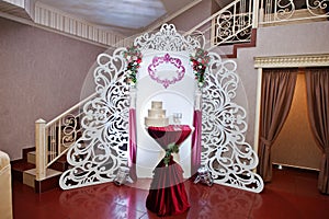 Wedding photo zone with different decor on restaurant.