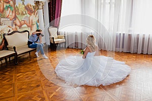 Wedding photographer is shooting portrait of the bride