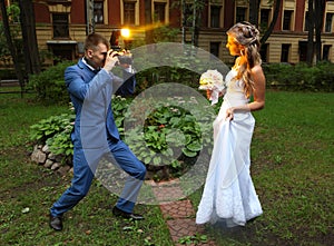 Wedding Photographer Taking Picture bride, camera flash flashing