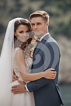 Wedding photography of a young couple, the bride and groom in a mountainous area in summer photo