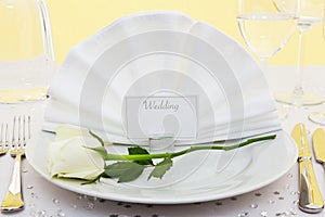 Wedding place setting with white rose