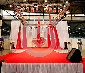 Wedding podium covered with red carpet