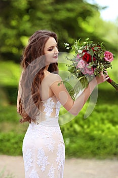 Wedding Portrait Of Beautiful Happy Bride with long wavy hair we