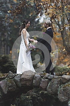 Wedding portrait of couple's first look in a park