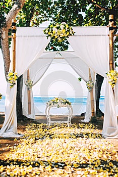 Wedding reception, ceremony venue on beach with flower details and ocean view
