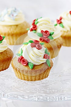 Wedding reception cupcakes decorated with sugarcraft red roses