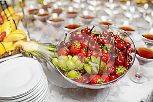 Wedding reception, decor table of fruits and caces