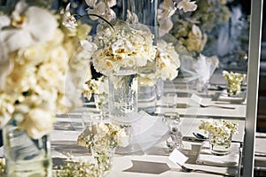 The white cream roses, orchids decoration on the reception dinner table, flowers, Floral - closed up