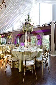 Wedding reception with purple uplighting