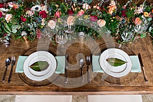 Wedding reception table setting with flower arrangements