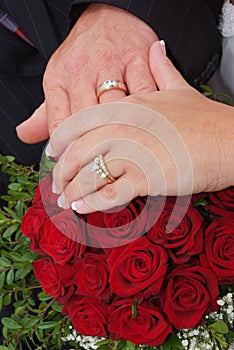 Wedding red rose bouquet and rings