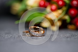 Wedding ring on the background of bride`s bouquet