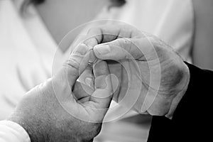 Wedding ring being passed