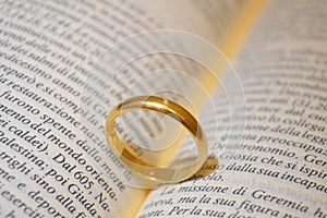 Wedding ring on bible book