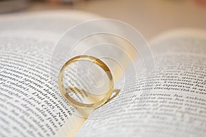 Wedding ring on bible book