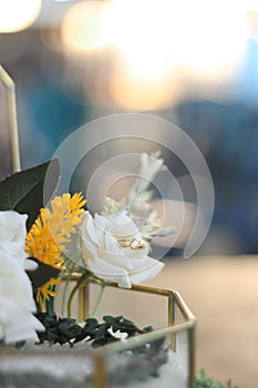 wedding ring on box with flower