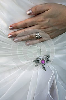 Wedding ring and dress photo