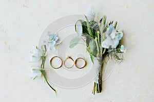 Wedding ring and flowers lay flat photo