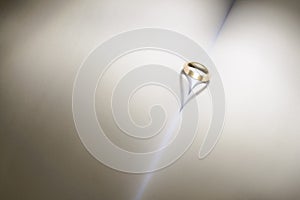 Wedding ring forming a heart with light effect
