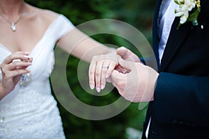 Wedding ring at the hand of the bride photo