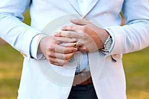 Wedding, ring and hand of man with loyalty, love and gold jewellery for hope in commitment. Engagement, marriage and