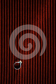 Wedding ring on red background