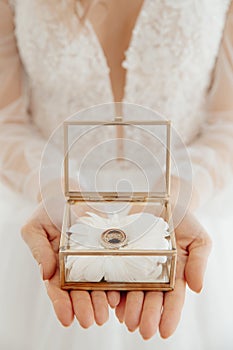 Wedding ring rings in hands of the bride