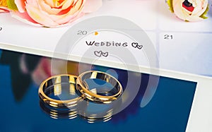Wedding ring on screen of smart phone love